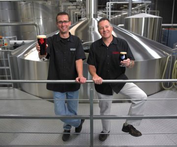 Stone Brewing Co. Co-founder & CEO, Greg Koch and President & Brewmaster, Steve Wagner, atop the Stone Brewhouse.