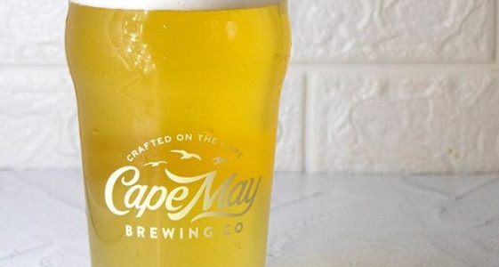 Cape May, NJ -- Cape May Brewing Company is pleased to announce a new, year-round addition to their line of core brands. Cape May White, a Belgian-style wheat ale brewed with coriander and orange peel, is currently available on draft and will be available in 12-ounce cans throughout New Jersey, Eastern Pennsylvania, and Delaware later this month. “We’re extraordinarily excited about our newest core brand,” says Cape May Brewing Company CEO and co-founder, Ryan Krill. “Keeping true to our commitment to variety and innovation, we wanted to bring something new and alluring to the market that will appeal to discriminating fans of Belgian-style beers. We’re happy to present Cape May White: a refreshing alternative in this category.” Cape May White began its journey as Cape May Brewing Company’s award-winning Great Wit Shark, having won a silver medal in the Belgian Wit category at the 2019 United States Beer Tasting Championships. Since then, Cape May Brewing Company has been perfecting the recipe for Cape May White. “We found ourselves with a gap in our core offerings and wanted to fill it with something exciting and new,” says Director of Sales, Bill Zaninelli. “Our sales team had been requesting a true witbier for years, and, as Great Wit Shark had been well-received on draft, this seemed like the perfect chance to scale up a trusted brand and fill a need in the market.” Keeping with the styling of Great Wit Shark, the branding for Cape May White is firmly rooted in shark imagery, with shark’s teeth lining the border of the can and a shark’s jaw comprising the primary visual concept. “As a shore brewery, we incorporate coastal iconography into much of our branding,” says Director of Marketing, Alicia Grasso, “and shark sightings can bring a sense of excitement to a typical summer season. While Cape May White is extraordinarily approachable, we feel that this beer will bring some much-needed excitement to a category that has seen little change over the years.” Designed as a traditional witbier, Cape May Brewing Company employed a predominantly wheat grain bill, a robust Belgian yeast, and added coriander and orange peel to the boil. “It’s incredibly well-balanced,” says Cape May Brewing Company Innovation Director, Brian Hink. “Zesty, refreshing, and crisp, Cape May White has excellent citrus notes, a fruity and intriguing yeast profile, and a light mouthfeel without feeling thin or watery. It’s refreshing and quaffable with a ton of underlying characteristics that are fun and inviting.” Cape May White is currently available on draft in New Jersey and Eastern Pennsylvania and will be available in Delaware as part of Cape May Brewing Company’s expansion into the state. 12-ounce cans will hit the shelves at the end of this month. For more information on Cape May Brewing Company, including for tours and tastings, see www.capemaybrewery.com or call (609) 849-9933. ### About Cape May Brewing Company: CMBC started in 2011, with three guys making one beer in a 1,500 square-foot space. Now, they’ve got over 32,000 square feet of space at the Cape May Airport and several hundred flagship, seasonal, and small-batch brews under their umbrella, distributed throughout all of New Jersey and Eastern Pennsylvania. Their original space is now dedicated to experimental brewing and their award-winning Tasting Room, with a separate, industrial brewing facility across the street. For more information, see Cape May Brewing Company’s website at www.capemaybrewery.com or call (609) 849-9933.