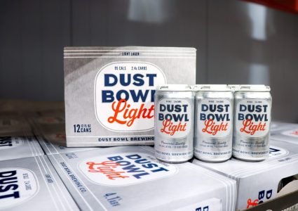 Dust Bowl Light Lager can and glass, showcasing a crisp, refreshing craft light lager from Dust Bowl Brewing Co.