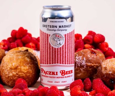 Eastern Market Brewing Co.'s 2025 Raspberry Pączki Beer, a rich pastry-inspired ale with raspberry and vanilla cream, available for pre-order ahead of the annual Pączki Block Party in Detroit.